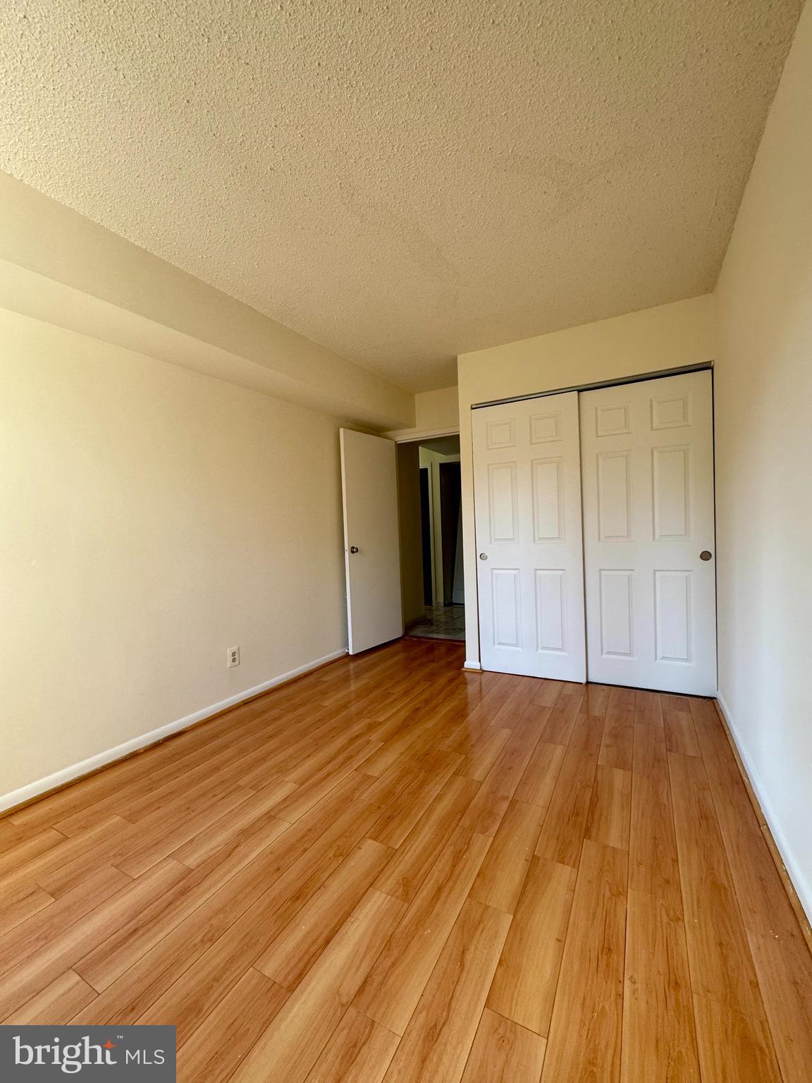 2247 Castle Rock Square, Unit 1B Reston, VA 20191 - Photo 15 of 26 a view of an empty room and wooden floor