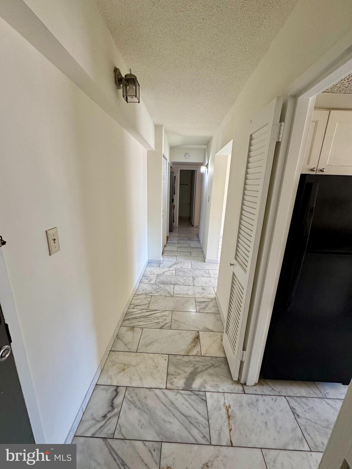 2247 Castle Rock Square, Unit 1B Reston, VA 20191 - Photo 2 of 26 a view of a hallway