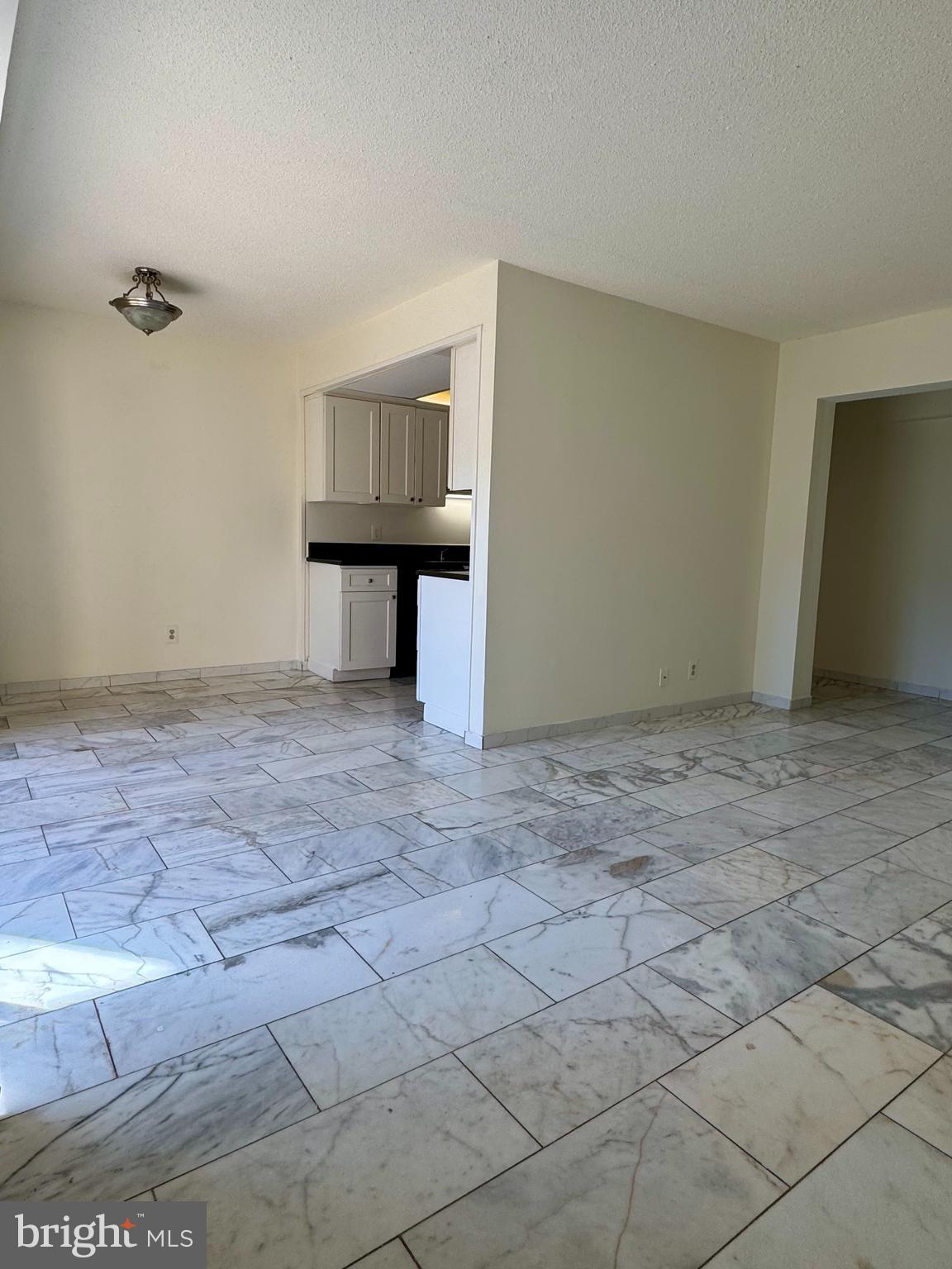 2247 Castle Rock Square, Unit 1B Reston, VA 20191 - Photo 6 of 26 a view of an empty room with a window