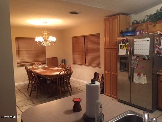 443 Tilhal Road Southwest Palm Bay, FL 32908 - Photo 8 of 18 Kitchen and Eating/Dining Area
