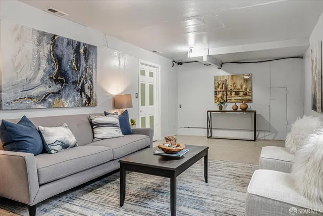 a living room with furniture and a table