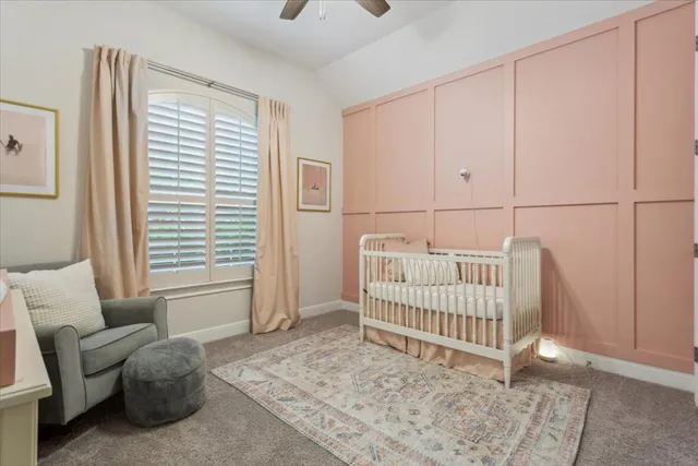 a bathroom with a granite countertop sink toilet and a mirror