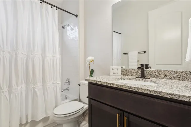 a living room with furniture rug and window