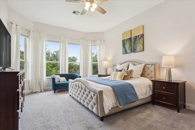 a bedroom with a bed and a couch