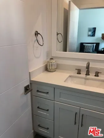 a bathroom with a sink and vanity