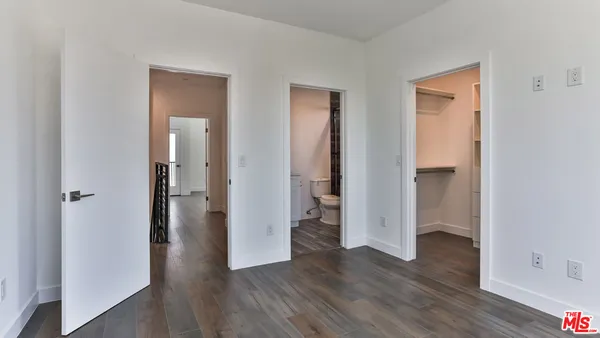 wooden floor with white walls