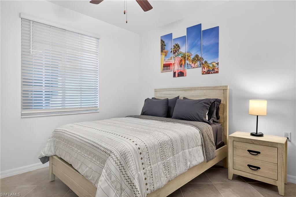 43985 Boardwalk Loop, Unit 2115 Punta Gorda, FL 33982 - Photo 15 of 28 a bed room with a bed and a painting on the wall