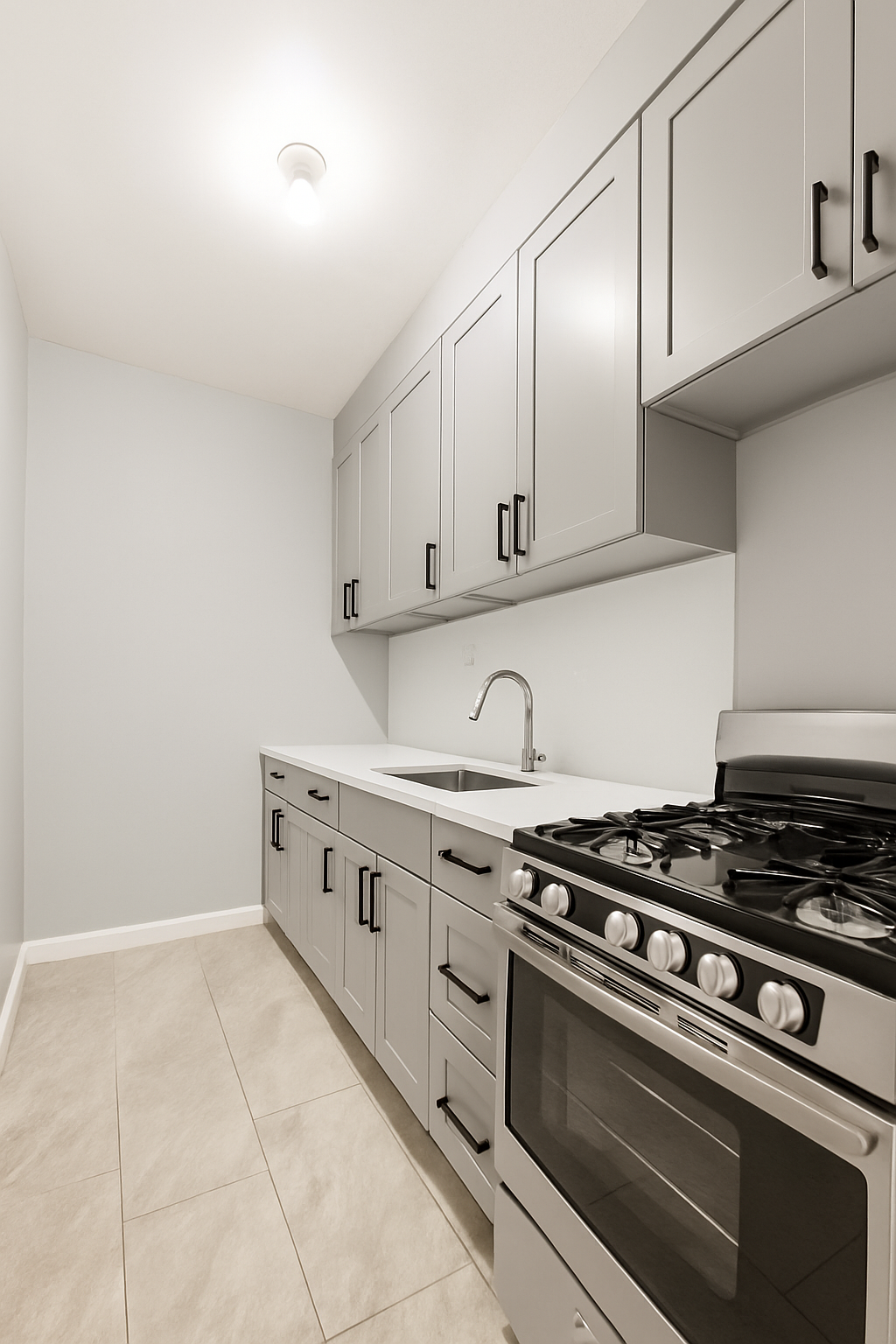 145-149 Morningside Avenue, Unit 1B Manhattan, NY 10027 - Photo 3 of 13 a kitchen with granite countertop a stove and a sink