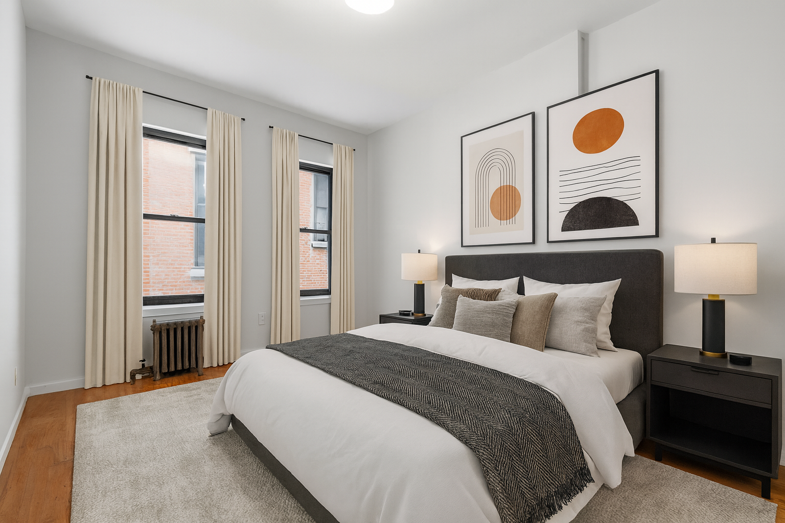 145-149 Morningside Avenue, Unit 1B Manhattan, NY 10027 - Photo 4 of 13 a bedroom with a bed and a window