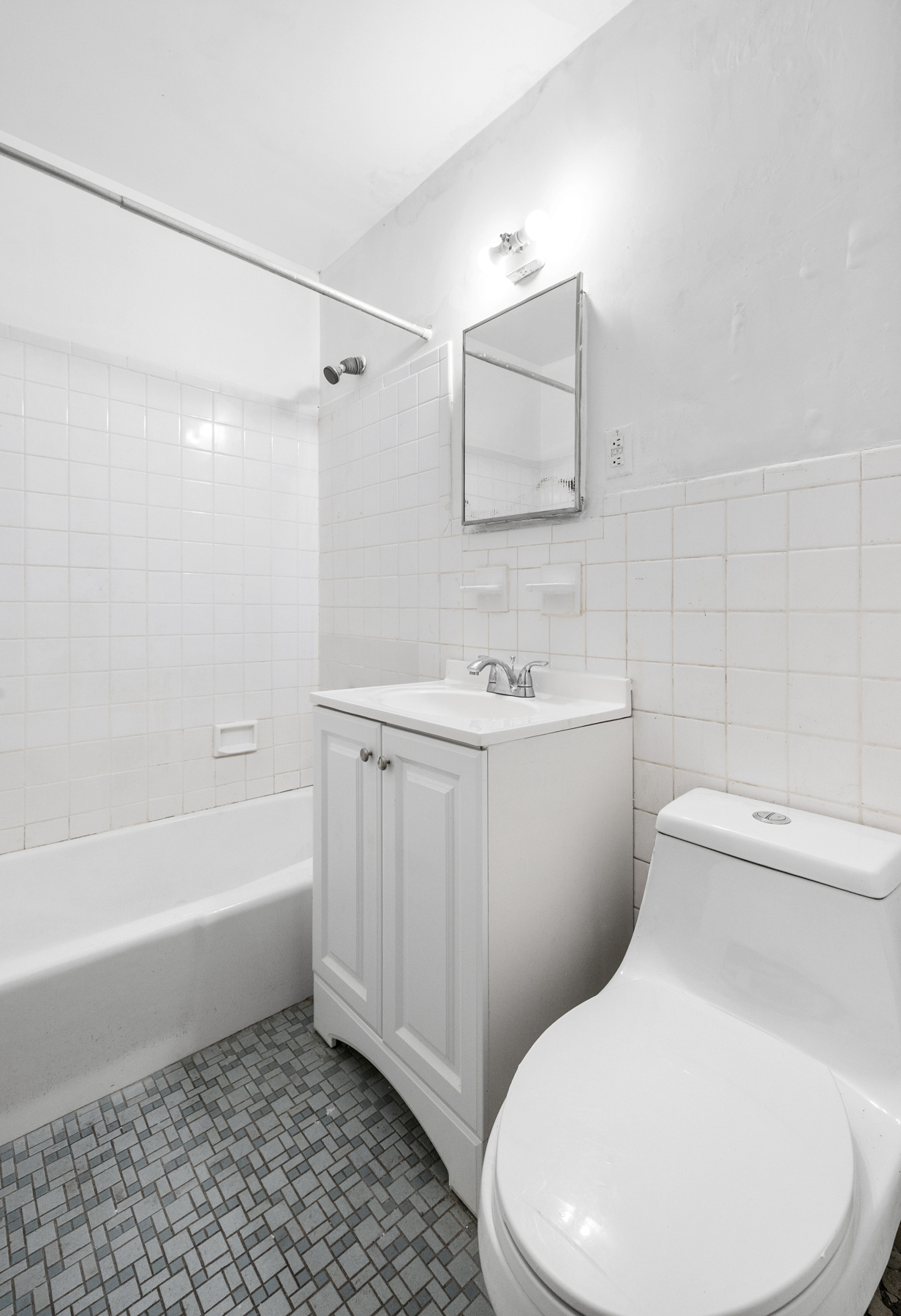 145-149 Morningside Avenue, Unit 1B Manhattan, NY 10027 - Photo 9 of 13 a white toilet sitting next to a bath tub