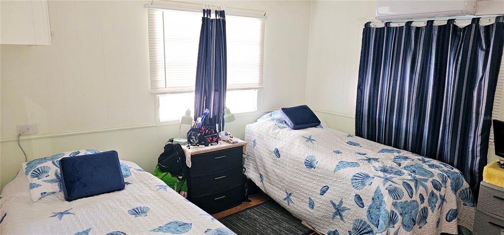 10315 Cortez Road West, Unit 281 Bradenton, FL 34210 - Photo 11 of 25 a bedroom with a bed and a dresser