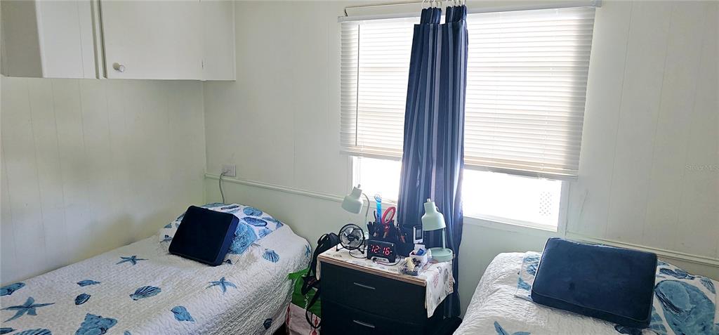 10315 Cortez Road West, Unit 281 Bradenton, FL 34210 - Photo 12 of 25 a bed room with furniture and a window
