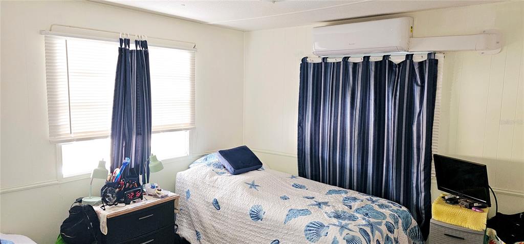 10315 Cortez Road West, Unit 281 Bradenton, FL 34210 - Photo 13 of 25 a bedroom with a bed and a window