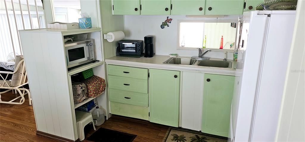 10315 Cortez Road West, Unit 281 Bradenton, FL 34210 - Photo 5 of 25 a kitchen with stainless steel appliances a stove and a refrigerator
