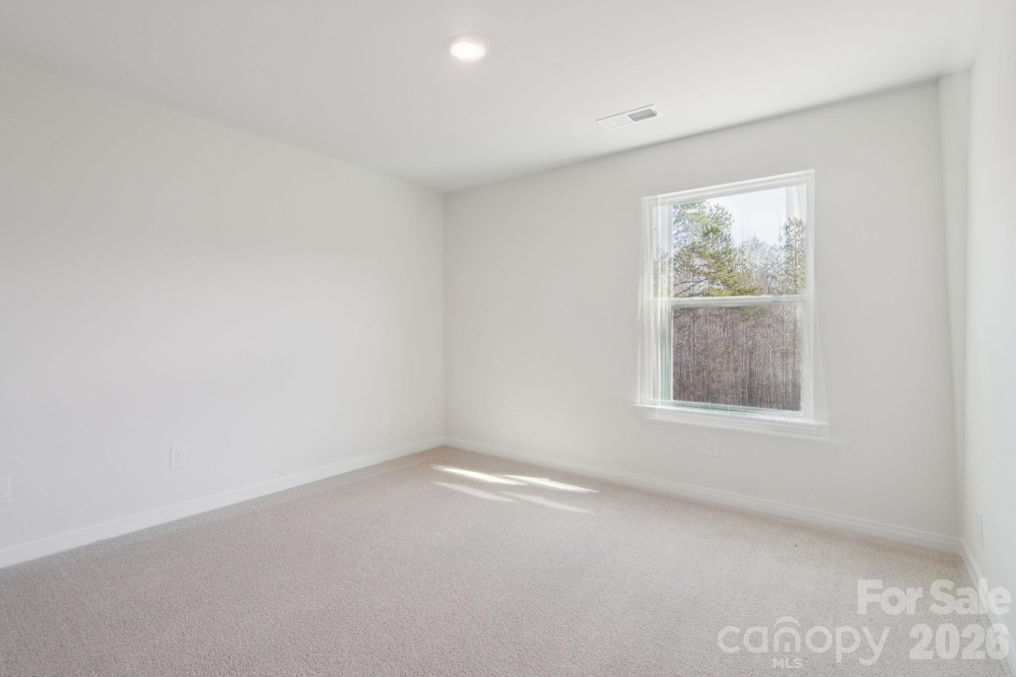 4559 Harris Elliot Road Lincolnton, NC 28092 - Photo 21 of 36 an empty room with a window
