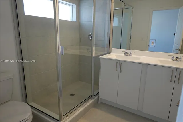 a white bath tub sitting next to a white toilet