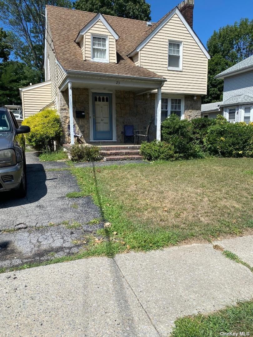 23 Remsen Street Lynbrook, NY 11563 - Photo 1 of 1 a front view of a house with garden