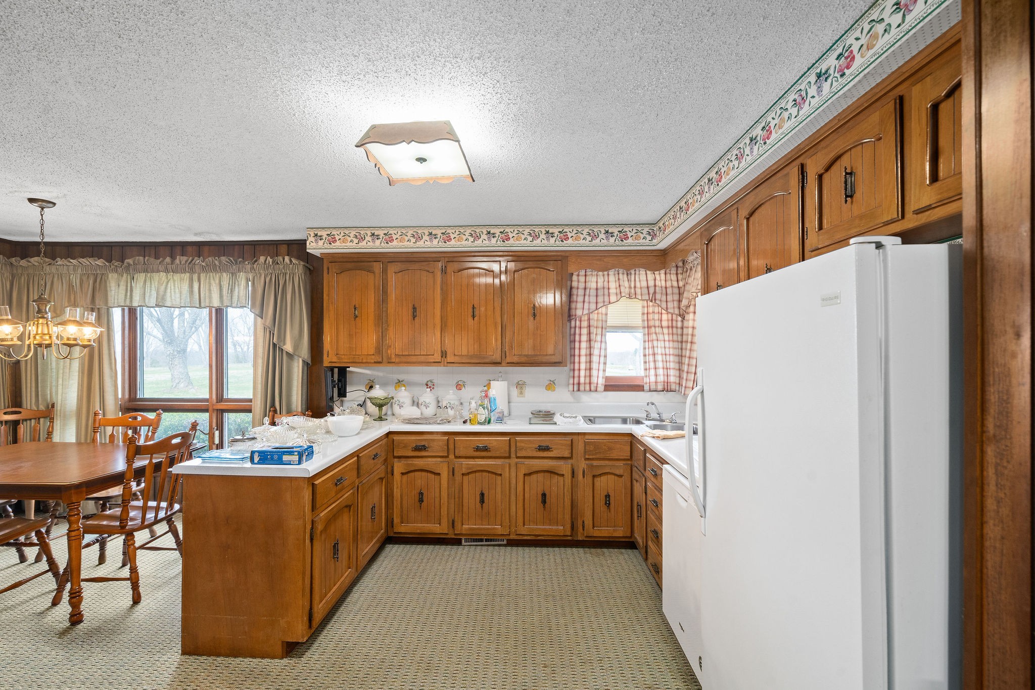 1075 Batson Mill Road Charlotte, TN 37036 - Photo 13 of 43 a kitchen with a sink refrigerator and window