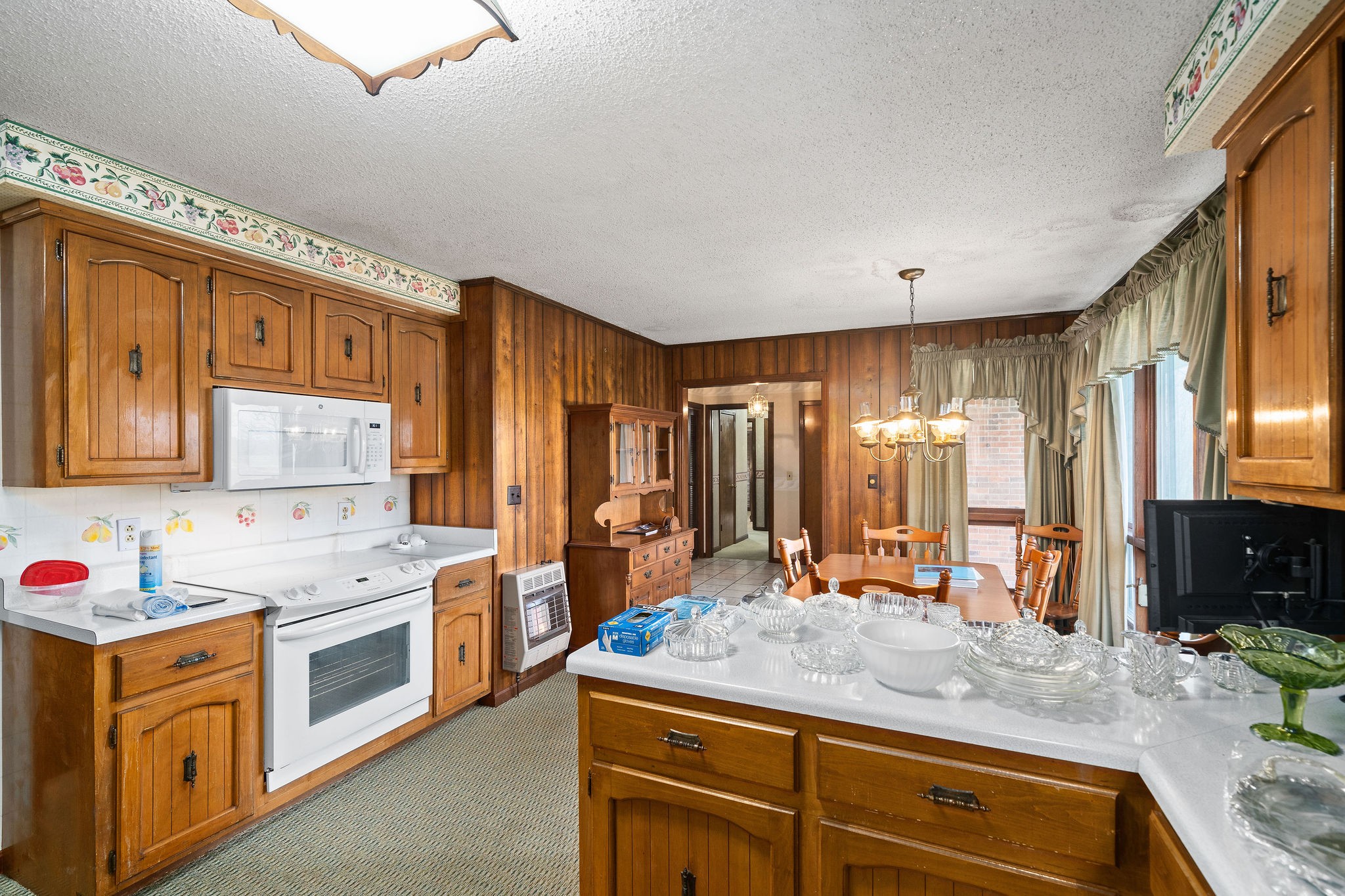 1075 Batson Mill Road Charlotte, TN 37036 - Photo 15 of 43 a kitchen with stainless steel appliances granite countertop a stove a sink and a refrigerator