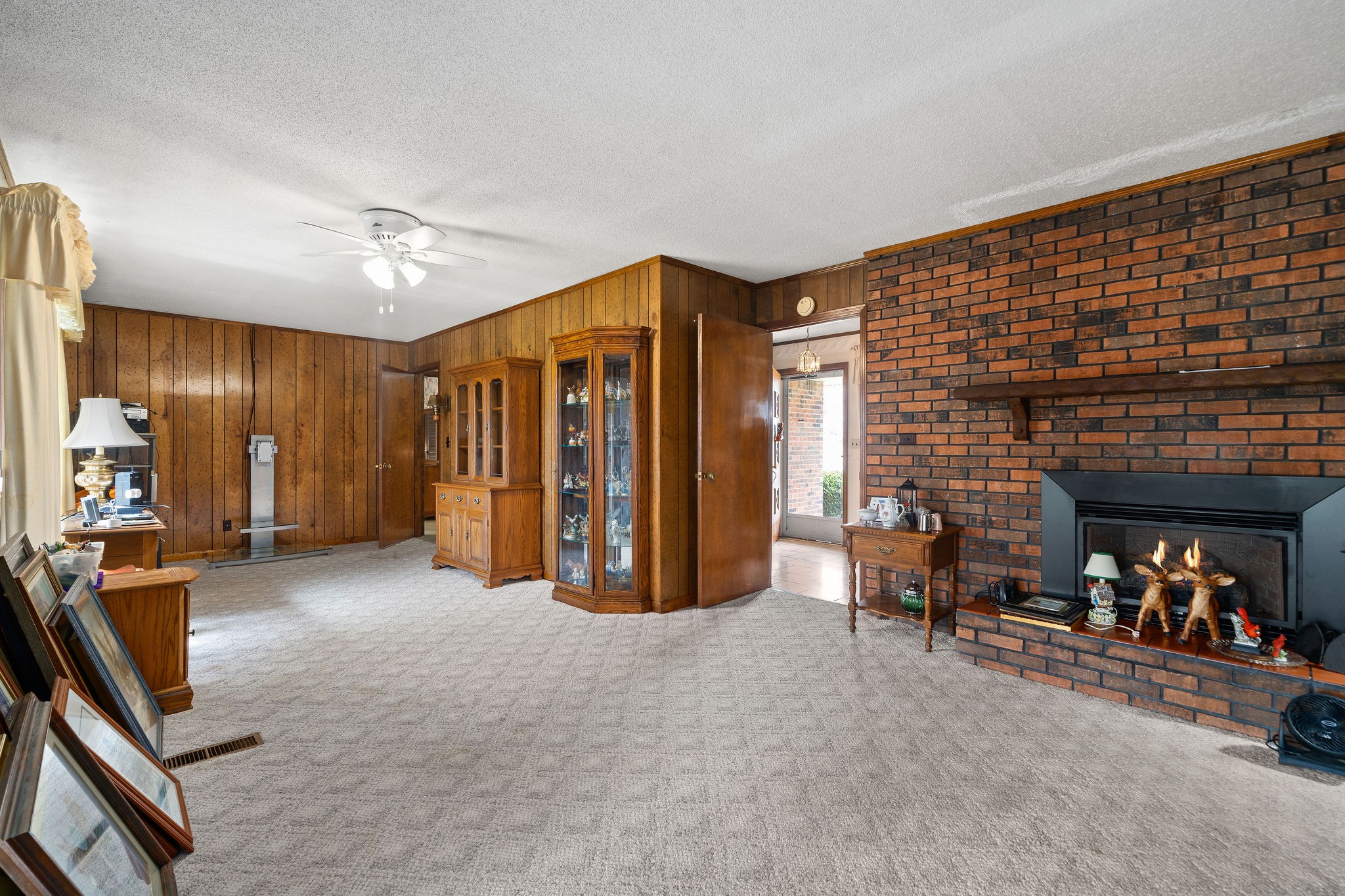 1075 Batson Mill Road Charlotte, TN 37036 - Photo 16 of 43 a view of a livingroom with furniture and a fireplace