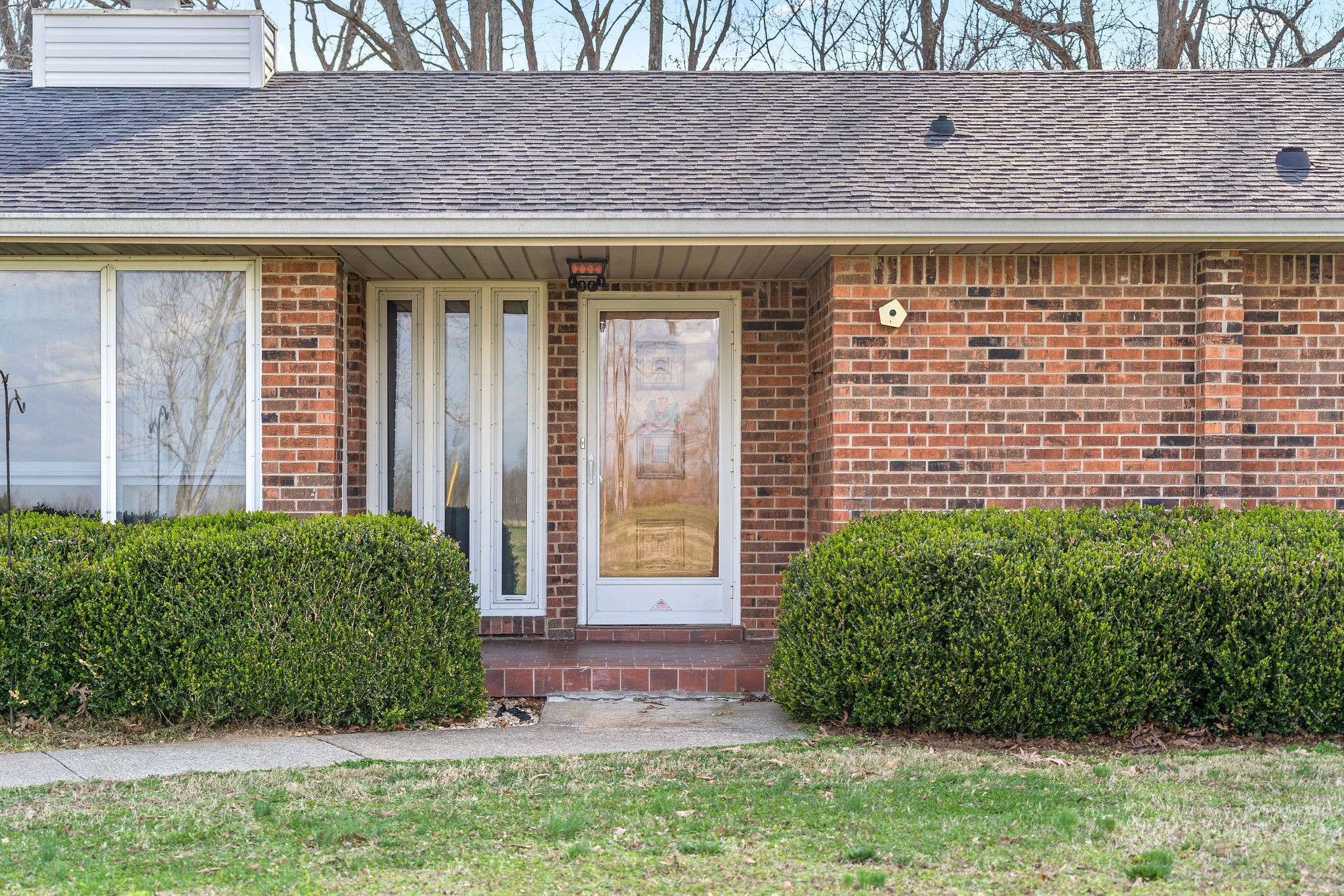 1075 Batson Mill Road Charlotte, TN 37036 - Photo 2 of 43 a front view of a house with a yard