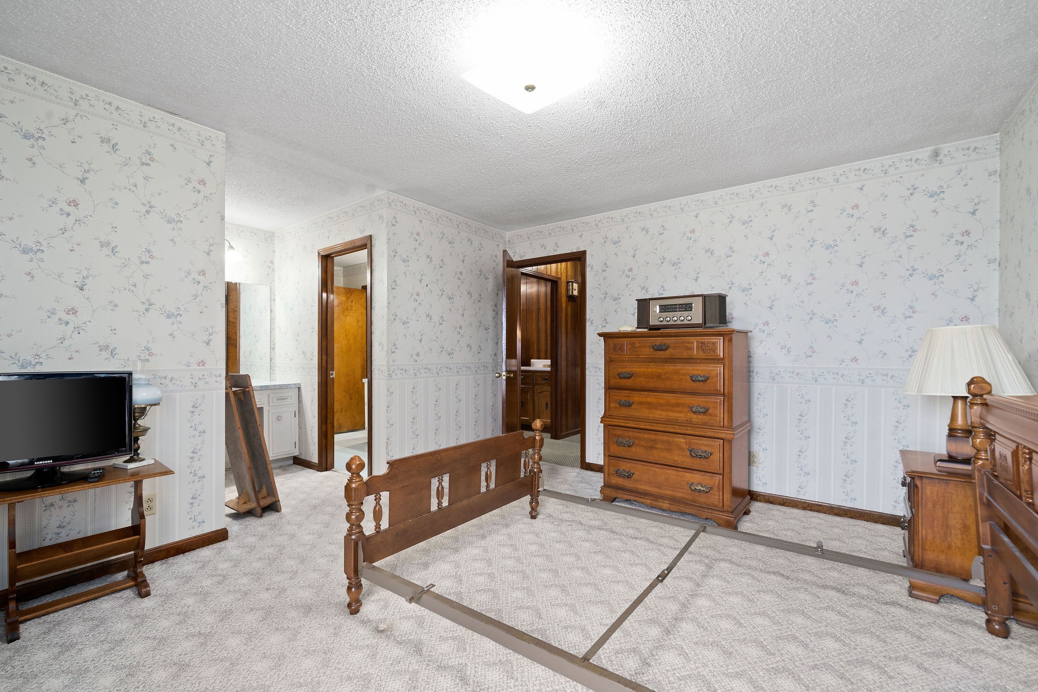 1075 Batson Mill Road Charlotte, TN 37036 - Photo 22 of 43 a living room with furniture and a flat screen tv