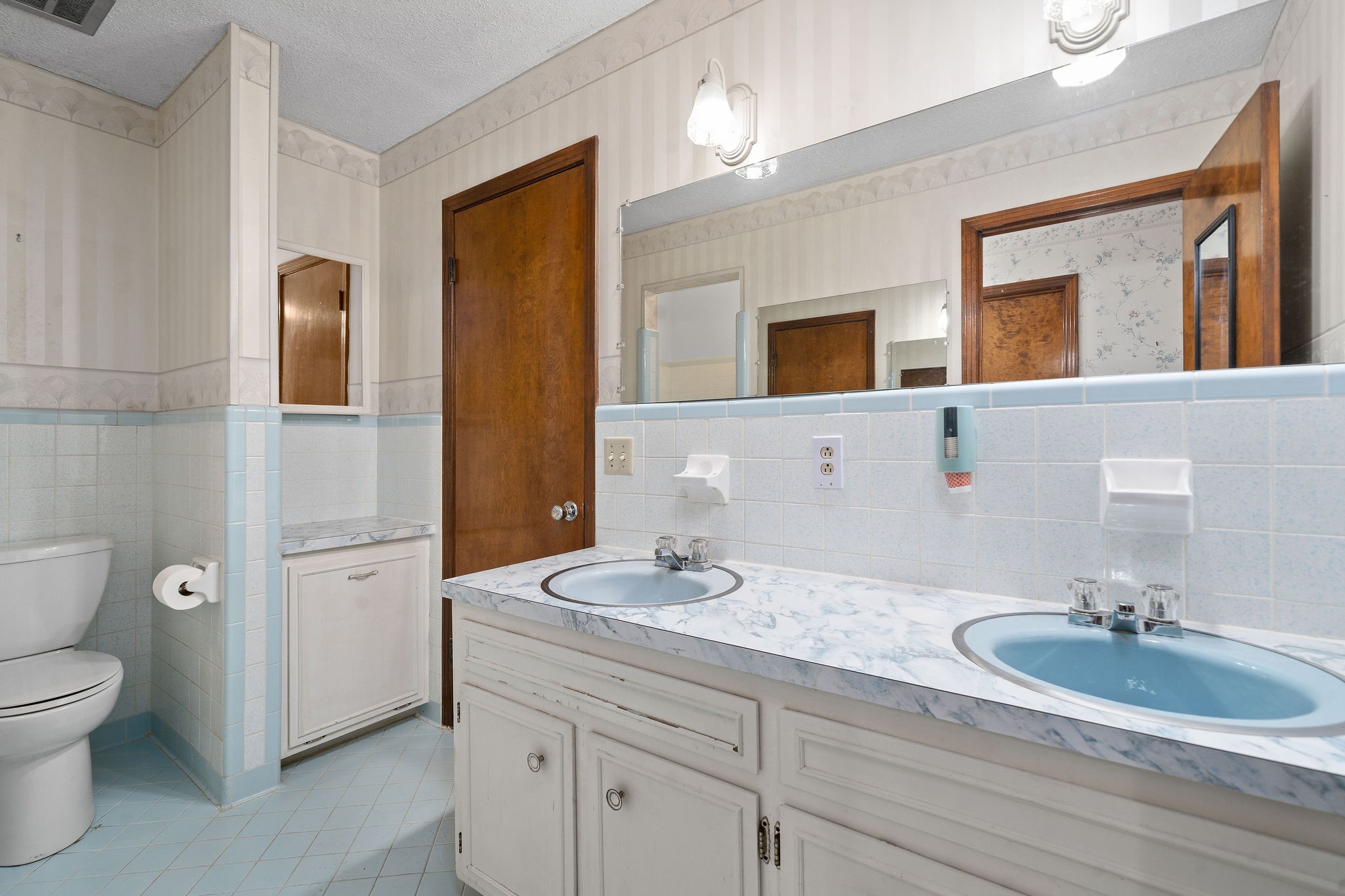 1075 Batson Mill Road Charlotte, TN 37036 - Photo 24 of 43 a bathroom with a granite countertop toilet sink and mirror