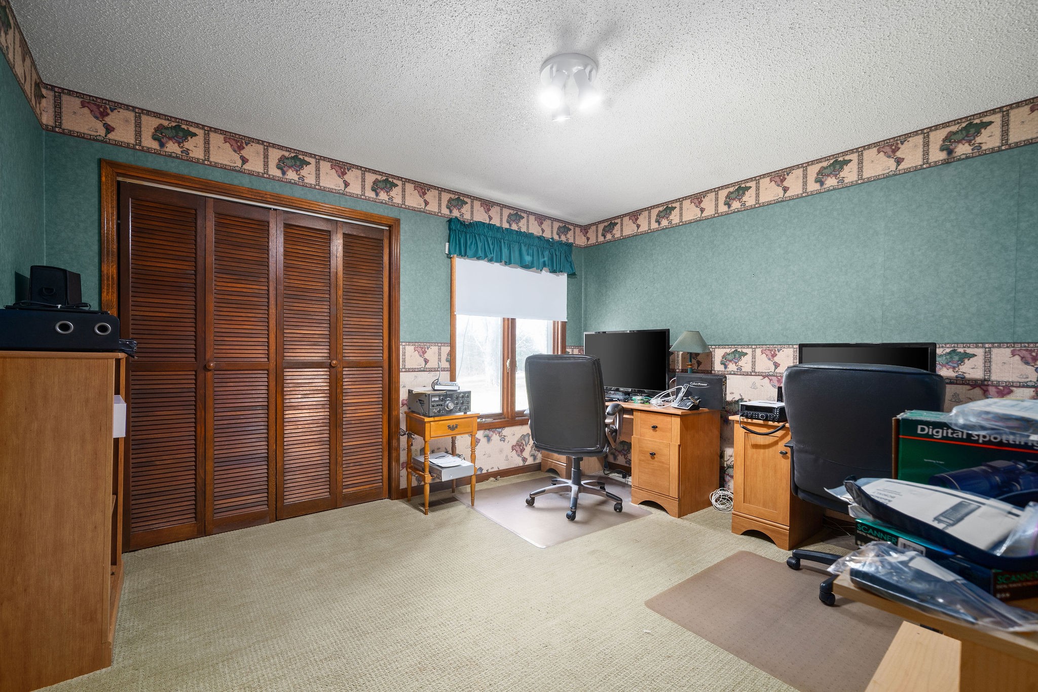 1075 Batson Mill Road Charlotte, TN 37036 - Photo 28 of 43 a view of a workspace with furniture and a window