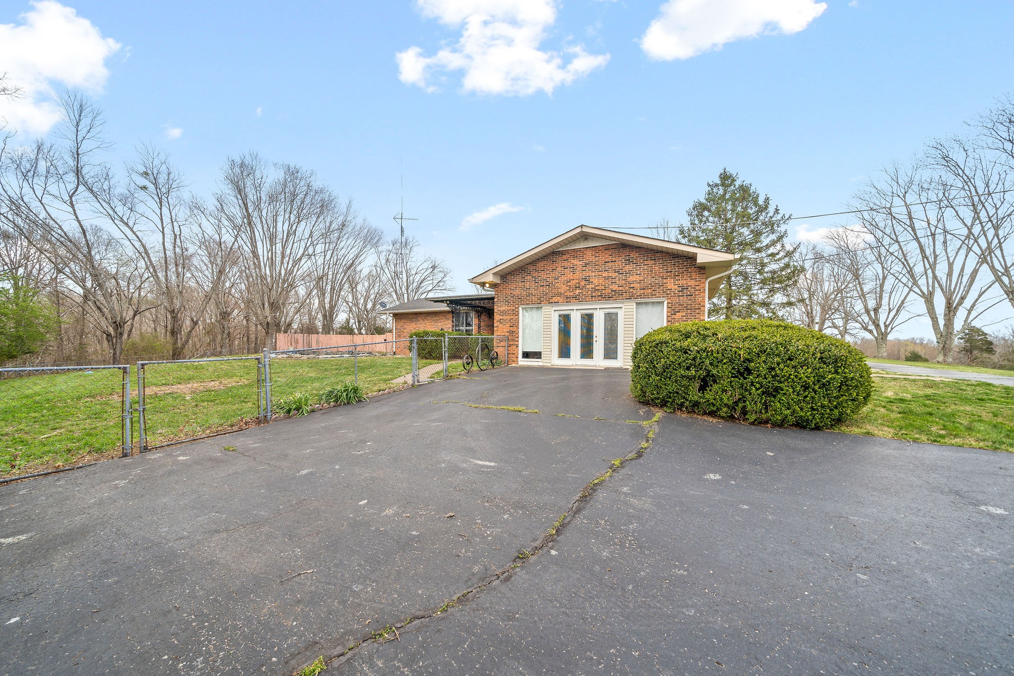 1075 Batson Mill Road Charlotte, TN 37036 - Photo 38 of 43 a view of a house with a yard and large tree
