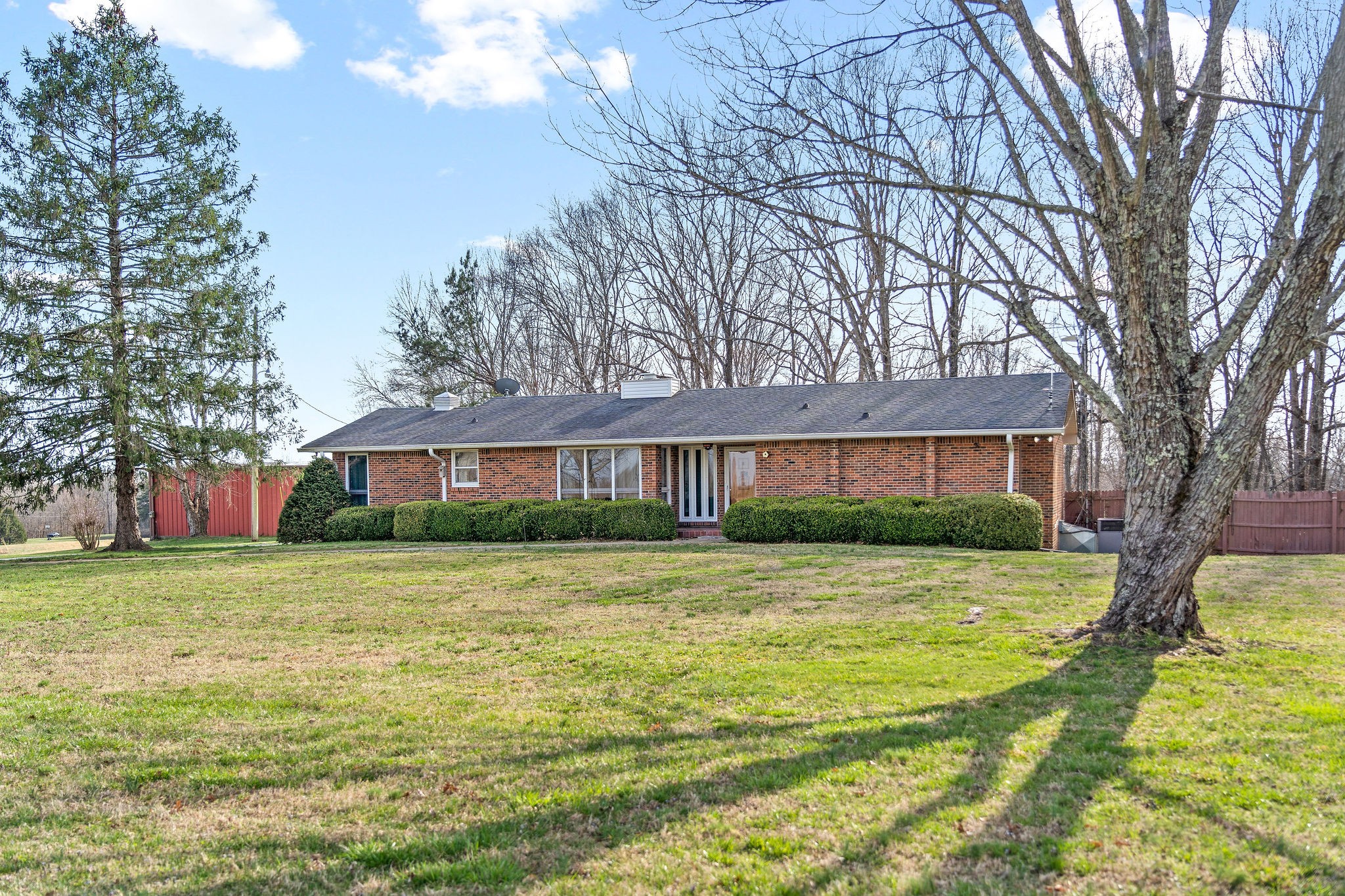 1075 Batson Mill Road Charlotte, TN 37036 - Photo 43 of 43 a view of a big yard with a house in the background