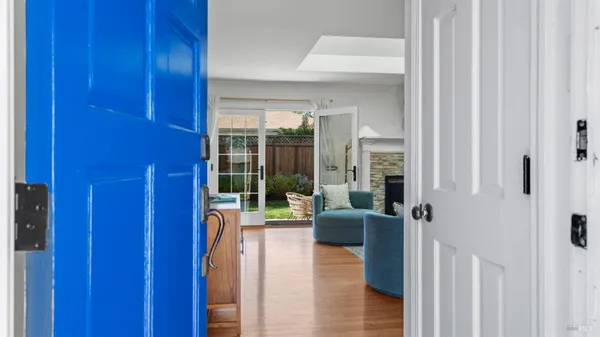 a view of a hallway with living room and furniture