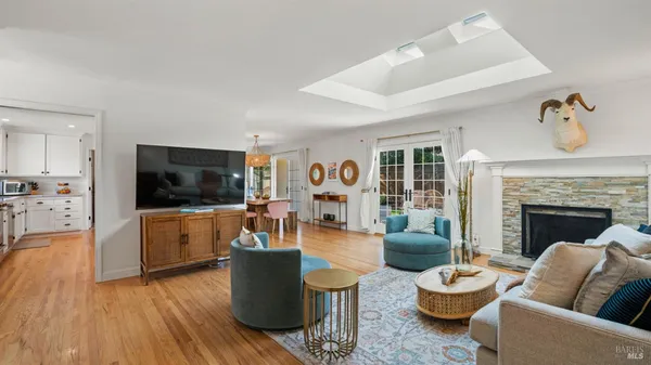 a living room with furniture fireplace and flat screen tv