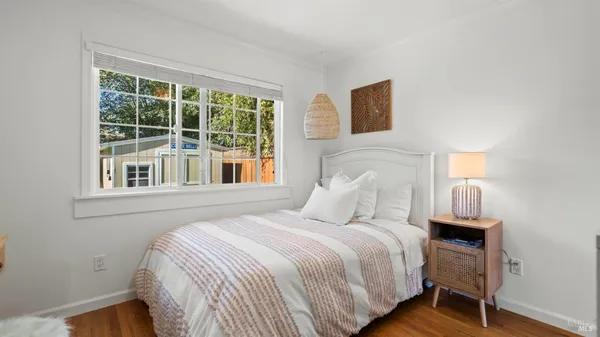 a bathroom with a sink vanity mirror and shower