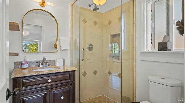 a bedroom with a bed and cabinets