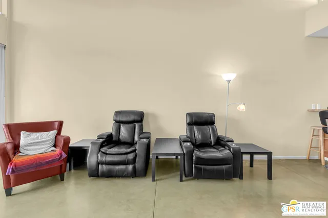 a living room with furniture and a lamp