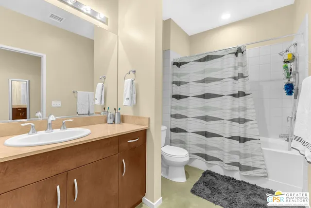 a bathroom with a sink toilet a shower and a mirror