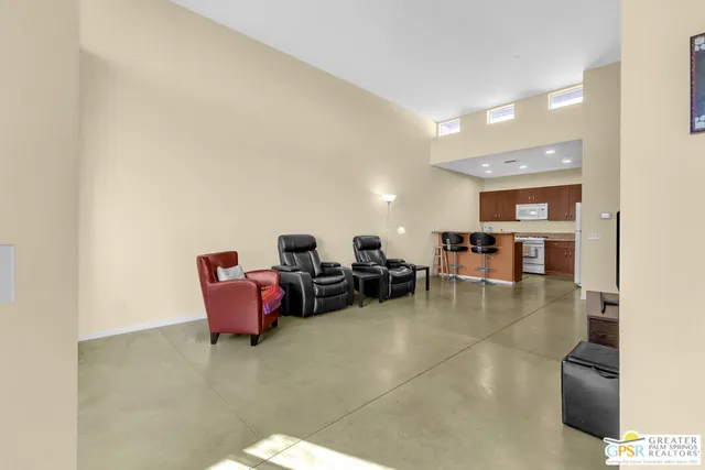 a living room with furniture and a table