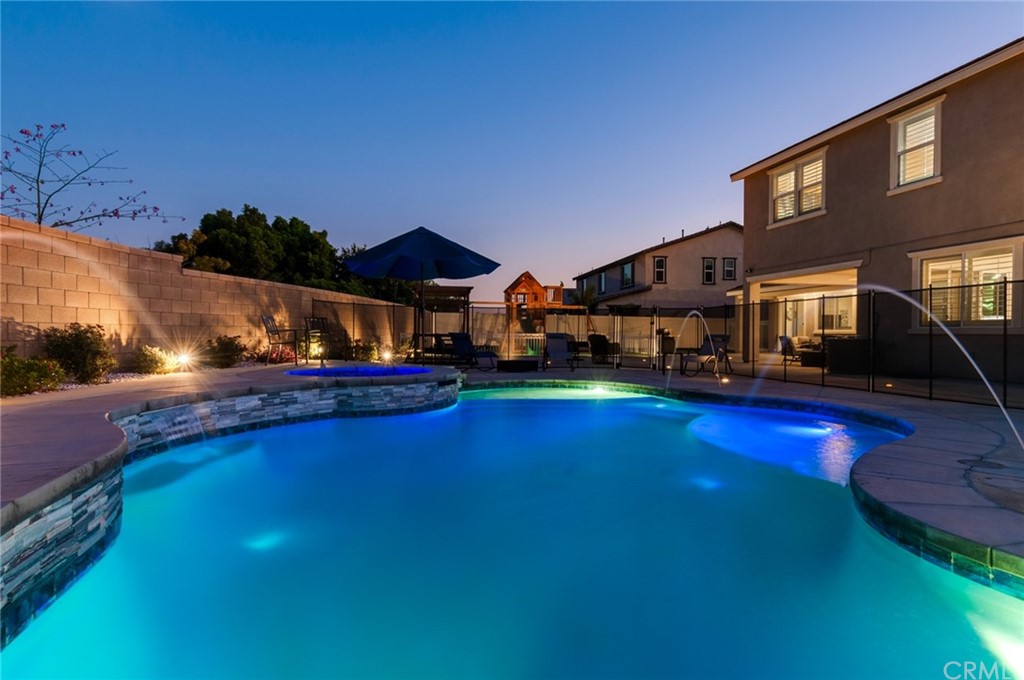 16524 Sol Avenue Riverside, CA 92503 - Photo 1 of 1 a swimming pool view with a seating space and a garden