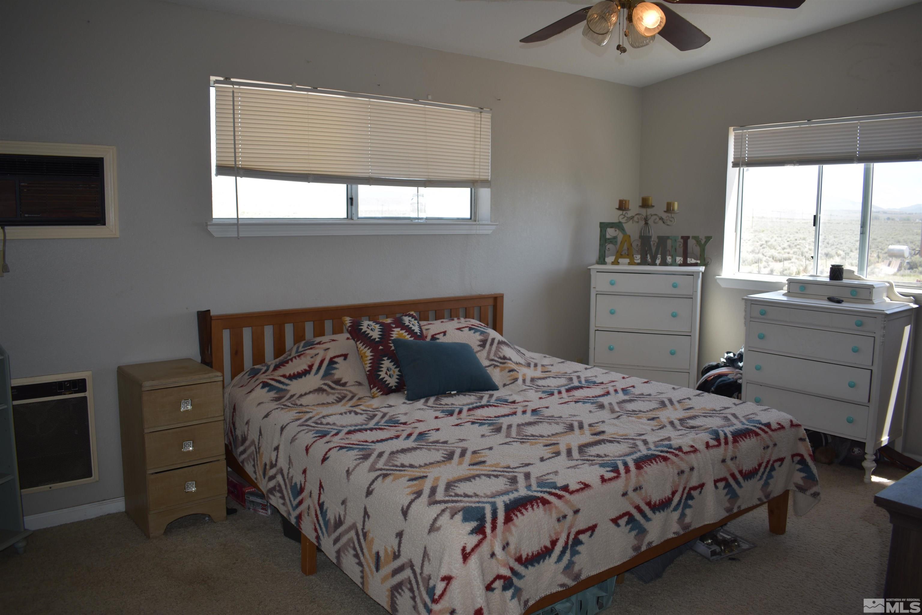 1737 Dee Jay Lane Minden, NV 89423 - Photo 13 of 40 a bedroom with a bed and window