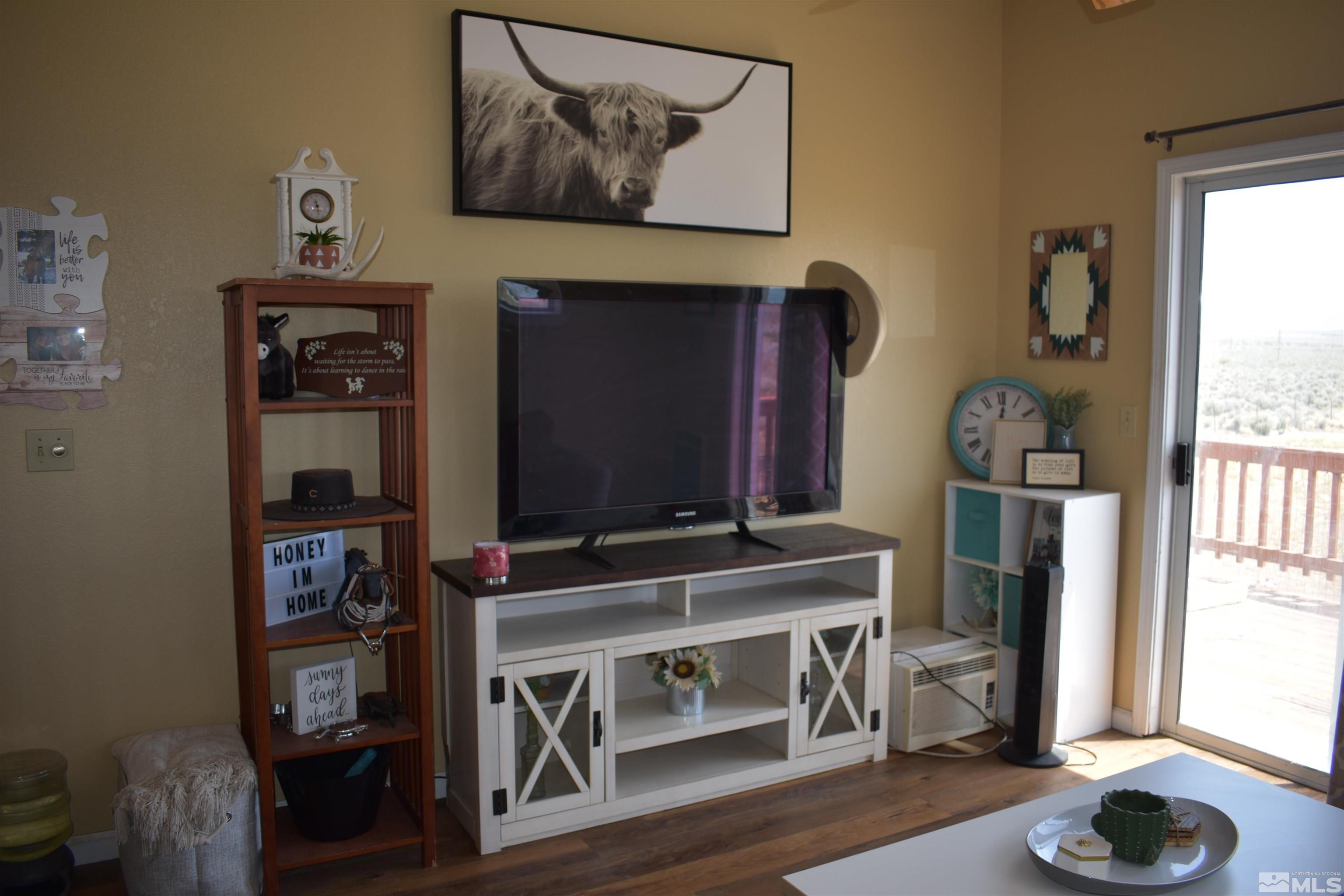 1737 Dee Jay Lane Minden, NV 89423 - Photo 21 of 40 a living room with furniture and a flat screen tv