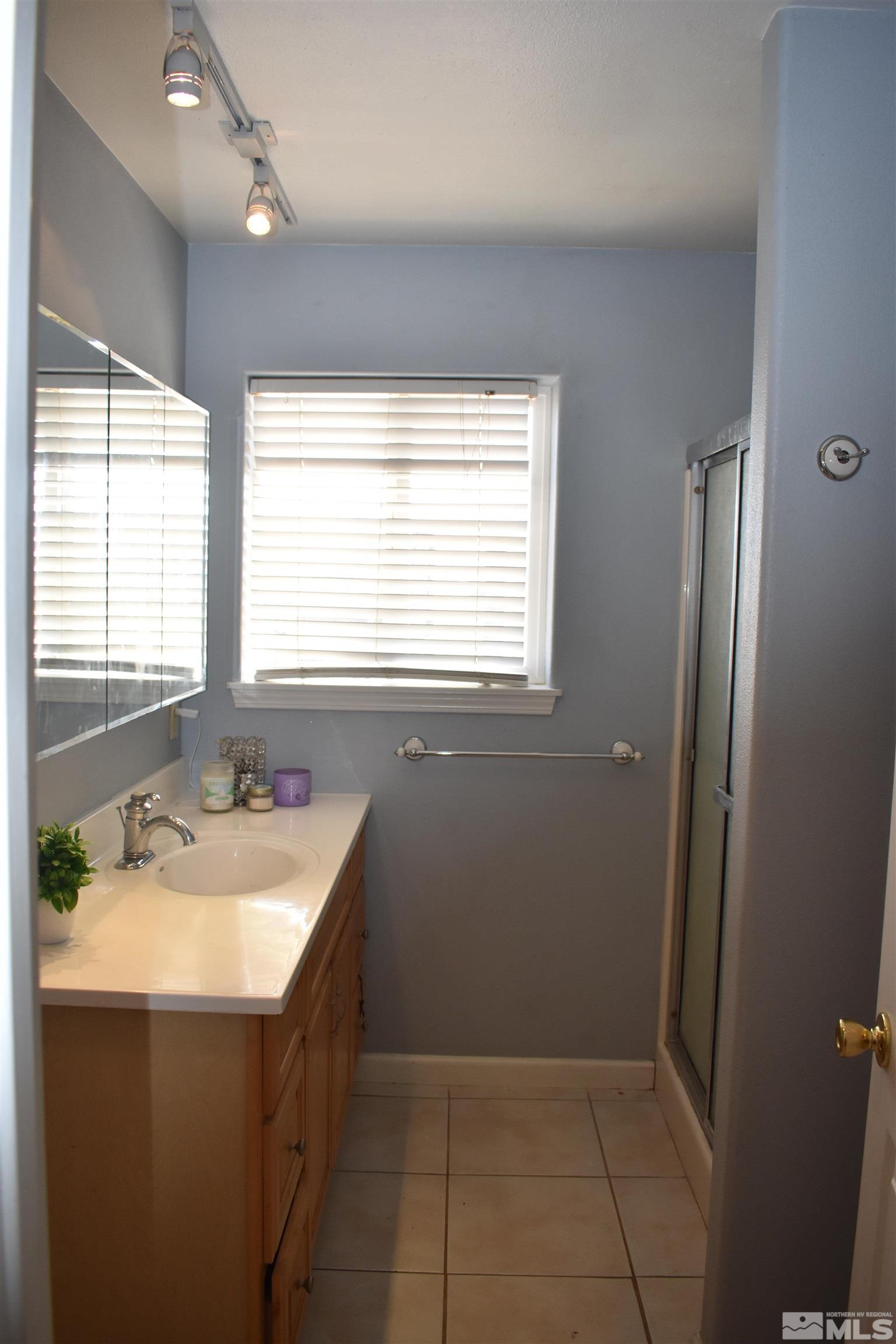 1737 Dee Jay Lane Minden, NV 89423 - Photo 27 of 40 a bathroom with a sink double vanity and tub