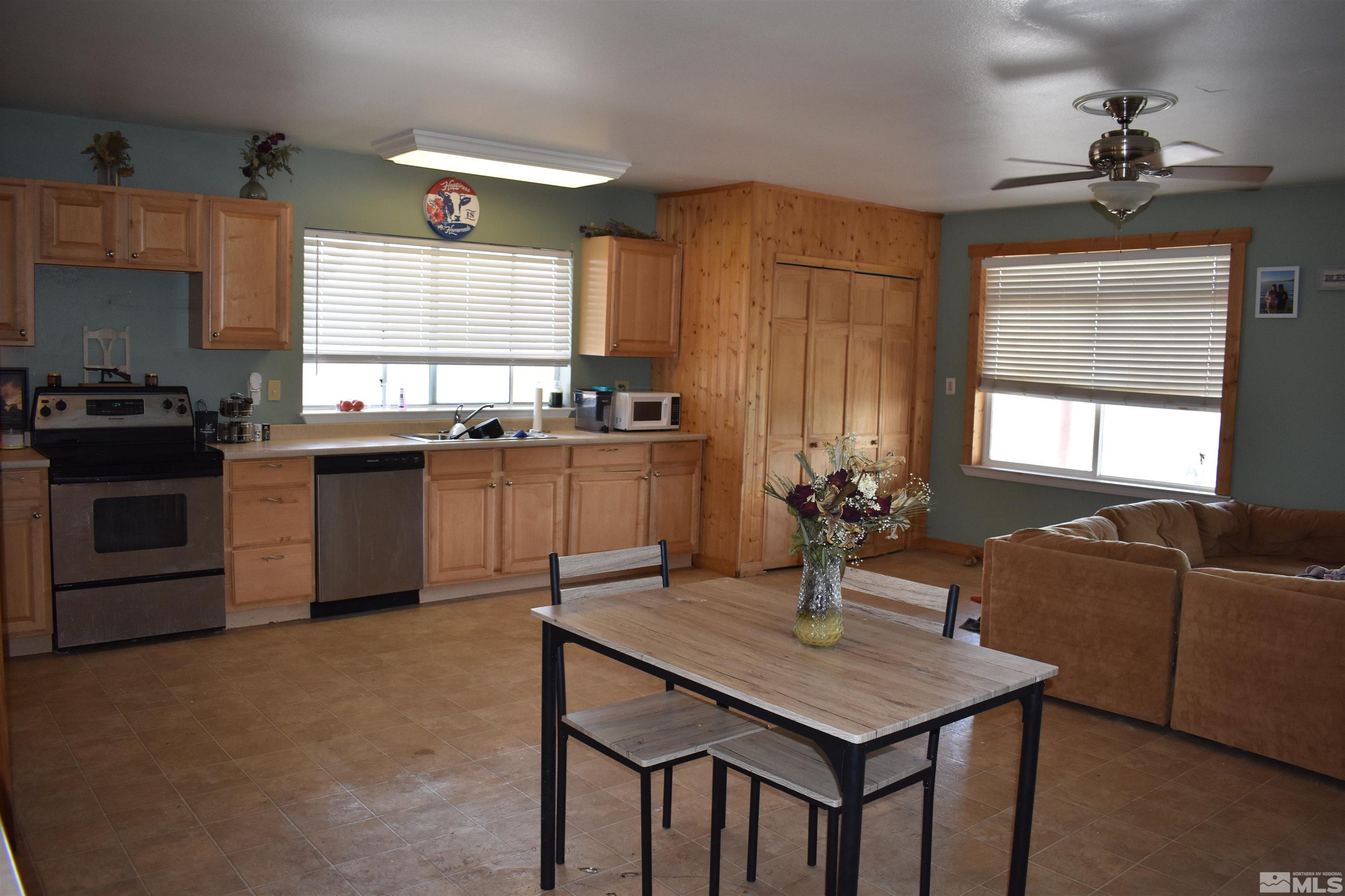 1737 Dee Jay Lane Minden, NV 89423 - Photo 10 of 40 a kitchen with granite countertop a sink stainless steel appliances and cabinets