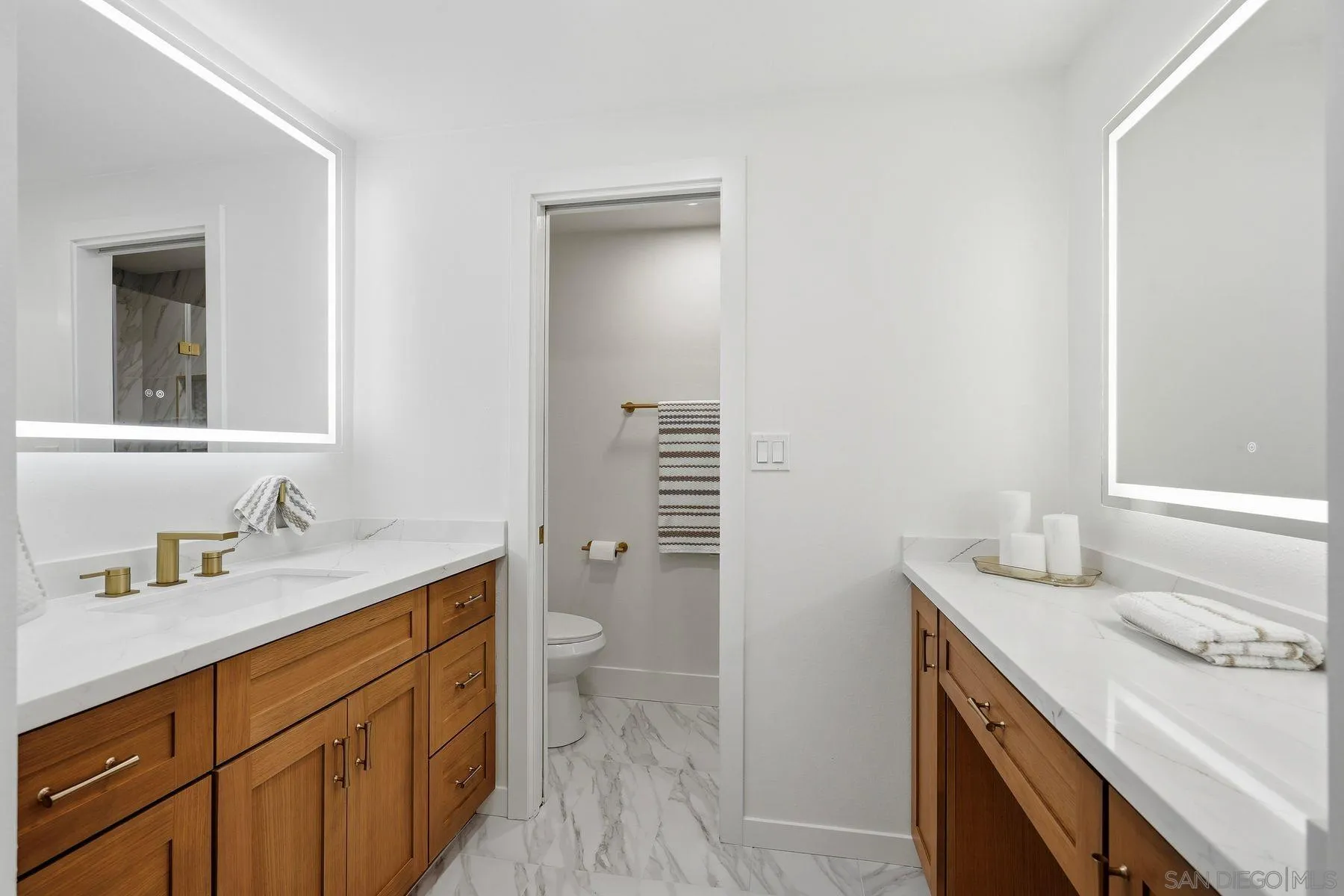 3606 Vista Rey, Unit 46 Oceanside, CA 92057 - Photo 15 of 36 a bathroom with a granite countertop sink toilet and mirror