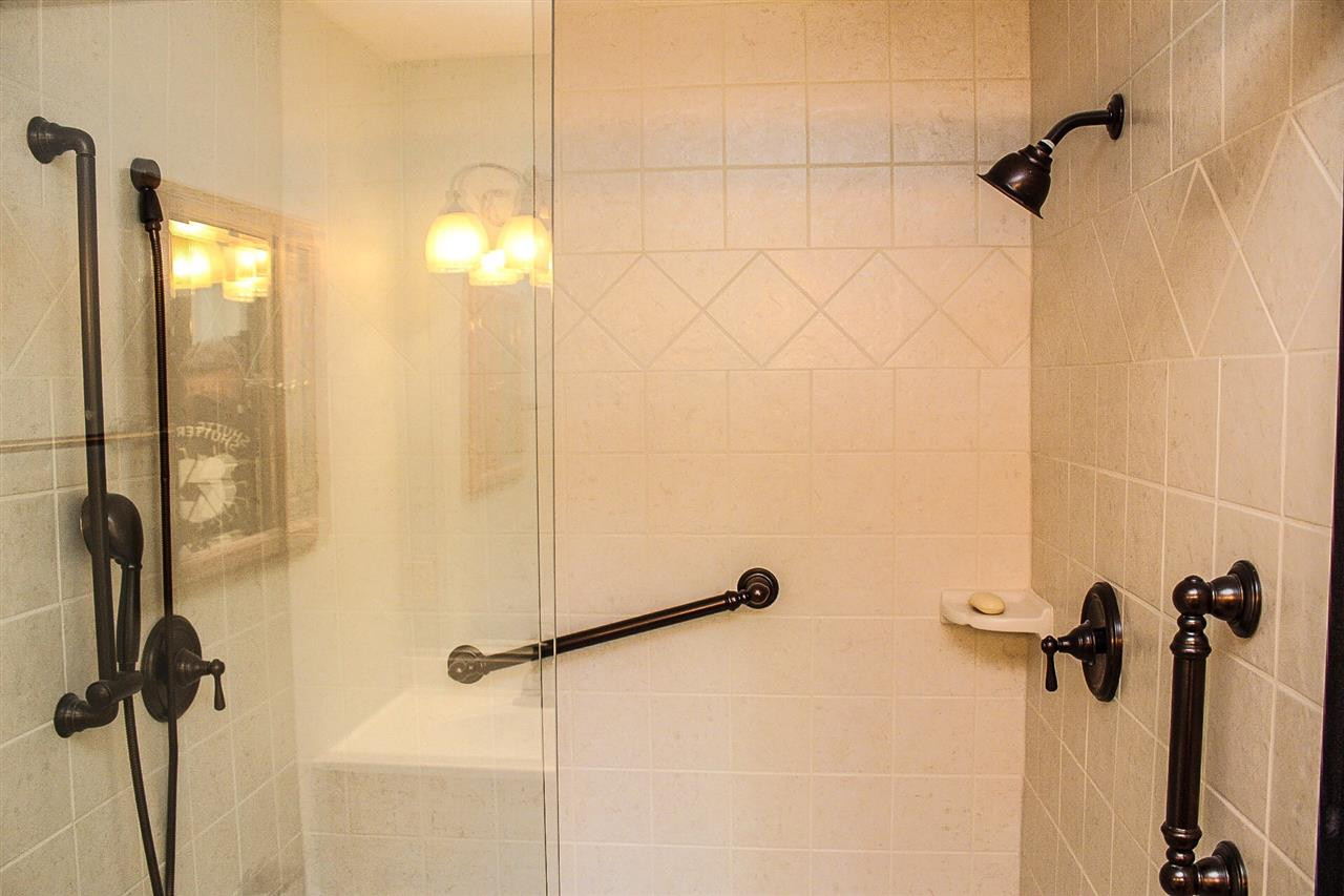 Oversized shower with bench seat and glass front Master Bath/Spa
