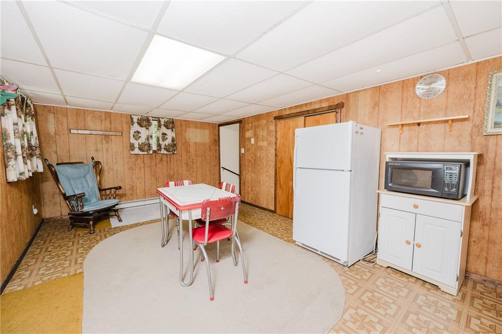 2129 Kirkland Road Clymer, PA 15728 - Photo 10 of 36 a room with furniture a refrigerator and a table