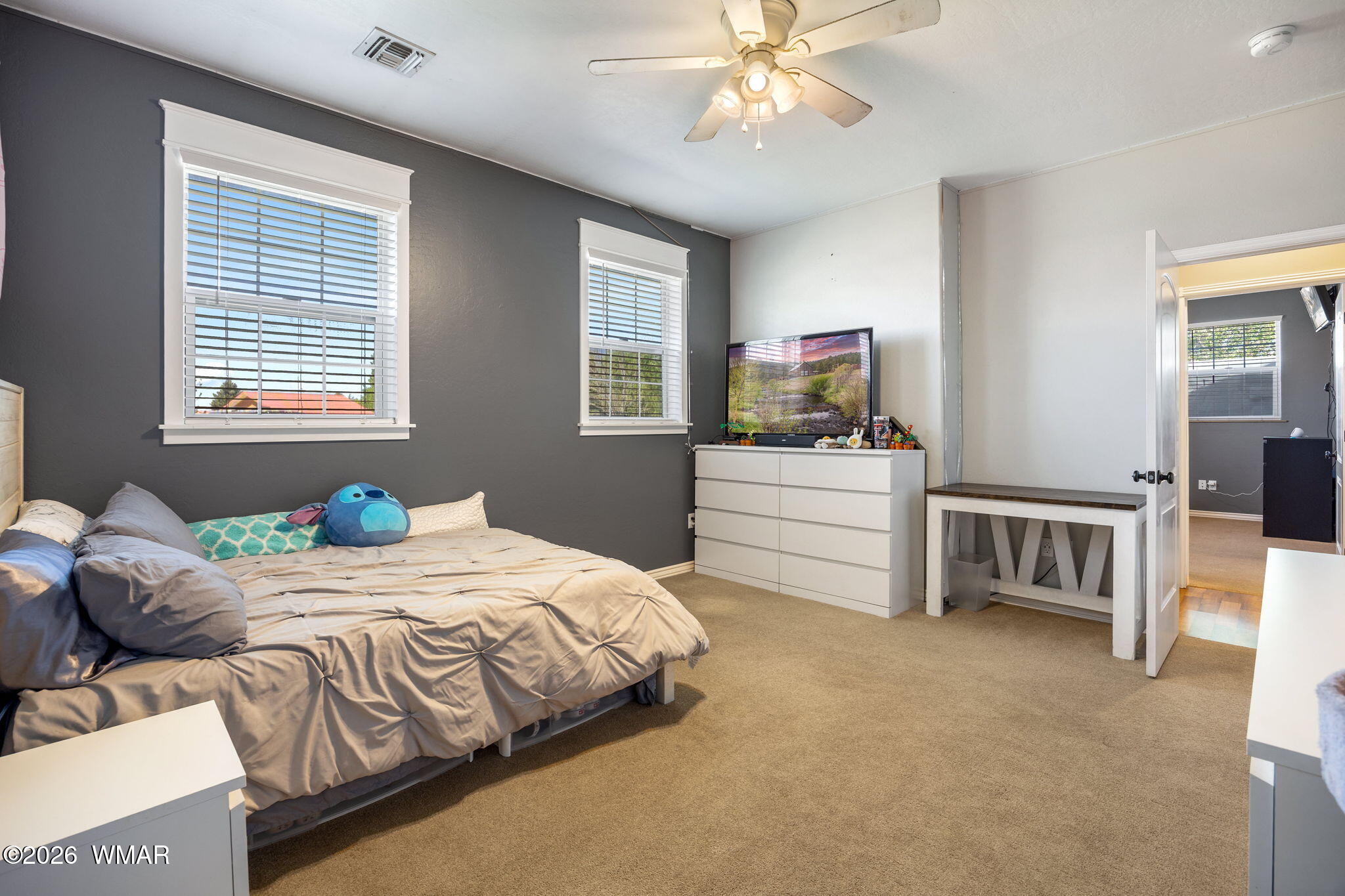 1940 Stonegate Way Heber, AZ 85928 - Photo 35 of 62 a bedroom with a bed and a chandelier