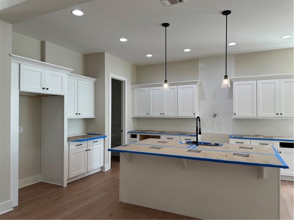 967 Cable Road Waleska, GA 30183 - Photo 14 of 27 a kitchen with kitchen island a sink stainless steel appliances and cabinets