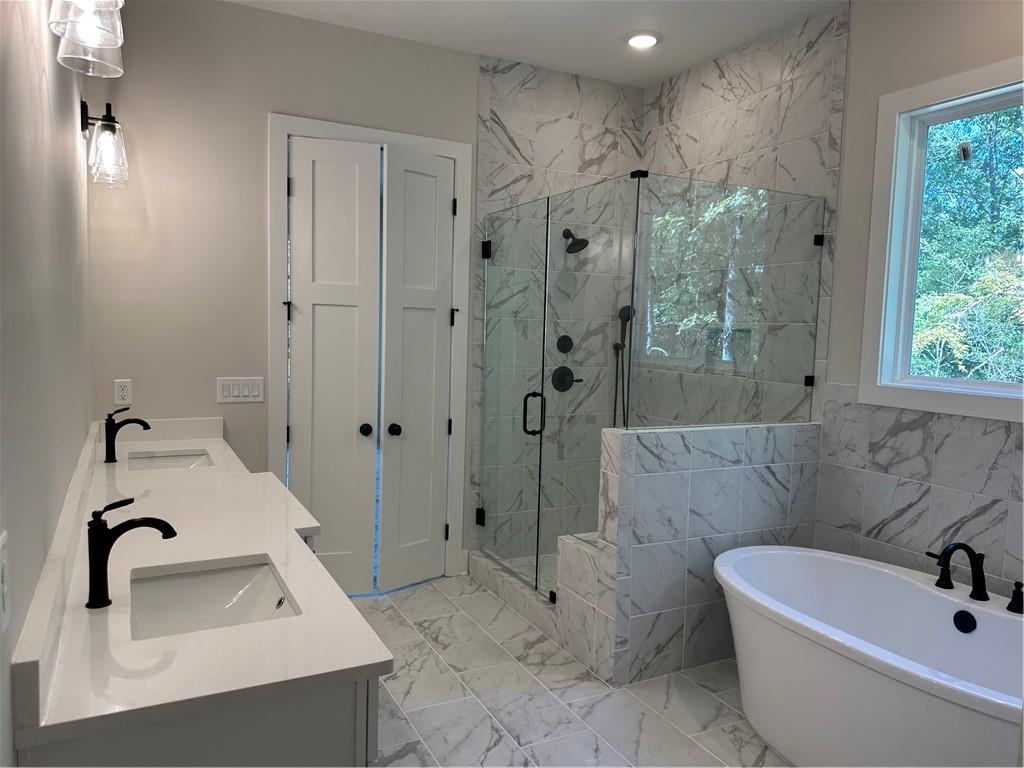 967 Cable Road Waleska, GA 30183 - Photo 20 of 27 a bathroom with a sink a toilet and shower