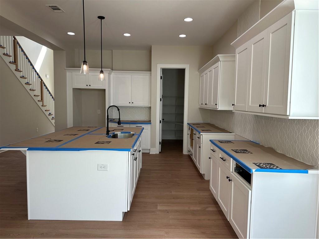 967 Cable Road Waleska, GA 30183 - Photo 24 of 27 a kitchen with kitchen island granite countertop a sink a stove and a refrigerator