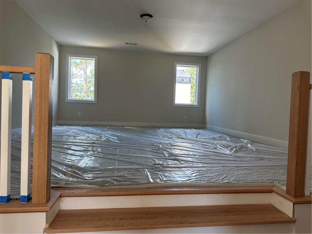 967 Cable Road Waleska, GA 30183 - Photo 6 of 27 a view of empty room with window and ceiling fan